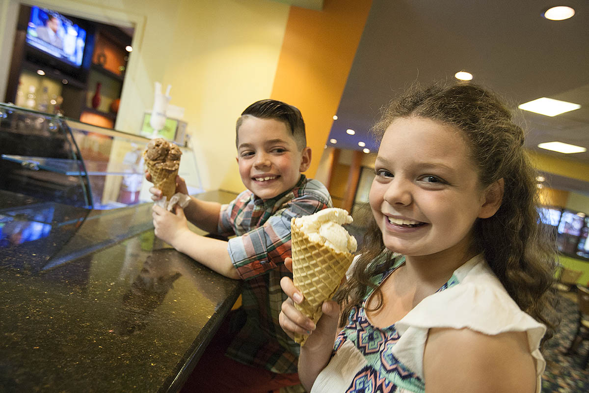 kids enjoying ice cream cones at the entertainment zone