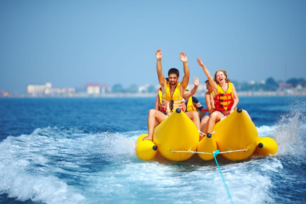 Myrtle Beach Boat Tours - Friends riding the banana boat