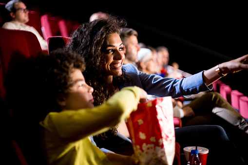 Happy woman enjoying entertainment in myrtle beach with son