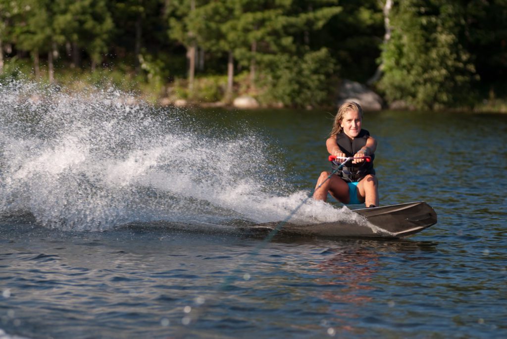 a teenager wakeboarding on the intracoastal waterway